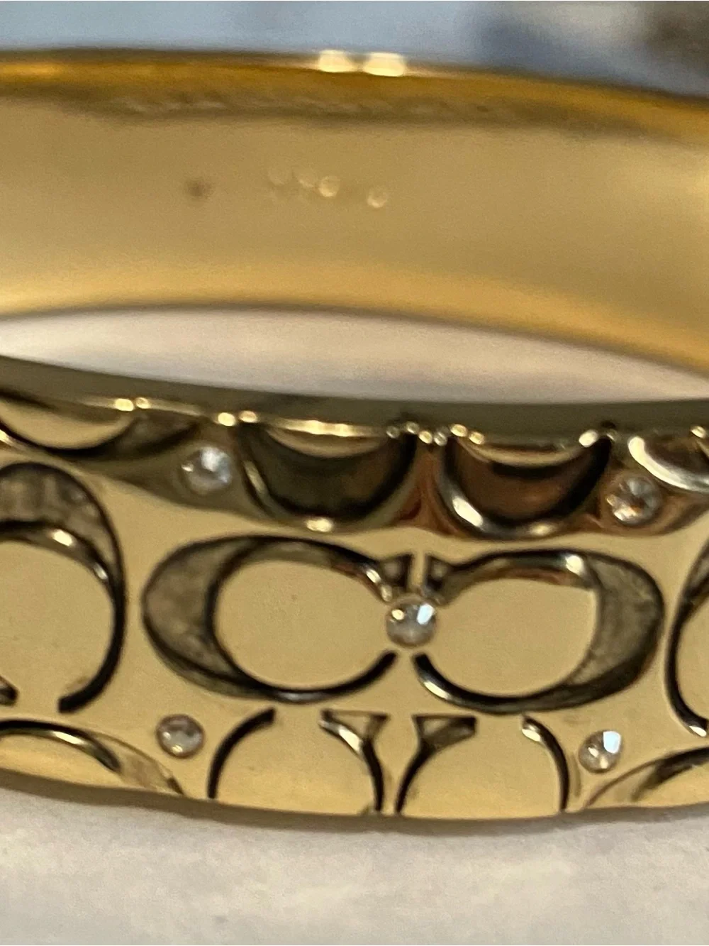 Gold-toned Coach Bangle